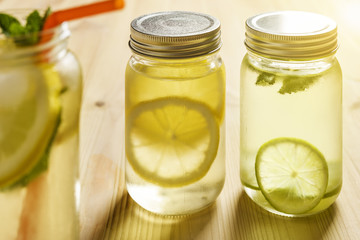 homemade summer refreshments with lime and lemon