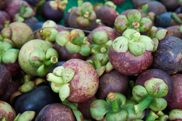 Naklejka na ściany i meble Close-up of mangosteen fruit at the pile together for sale.