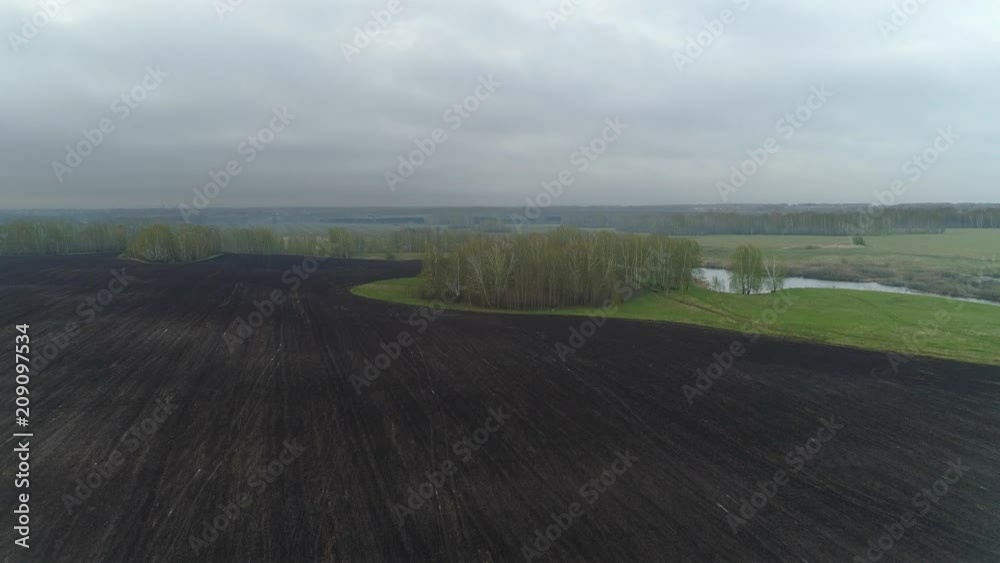 Wall mural Aerial view spring field landscape