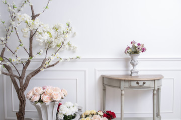 Elegant interior decoration with flowers on  white wedding background