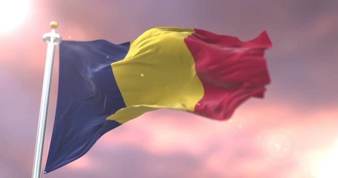 Flag of the Republic of Chad waving at wind at sunset, loop