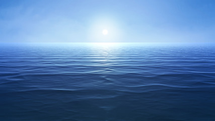 a blue ocean with sun over the horizon