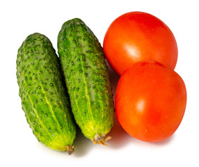 Tomatoes and cucumbers on white background isolation