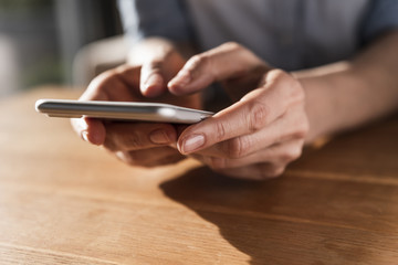 Woman's hands text messaging, close-up