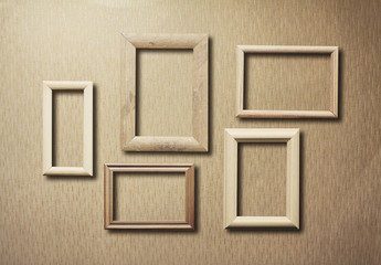Fototapeta premium old frames on wooden wall