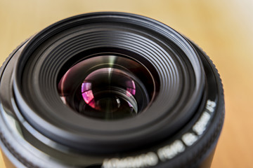 Wide-angle lens. A bright photo of the lens. 35 mm