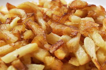 Fried potatoes close-up. Food background.