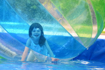 Little girl in a water ball