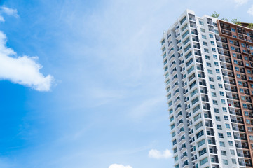 Fototapeta premium New building architecture on blue sky background,Low angle architectural exterior view of modern