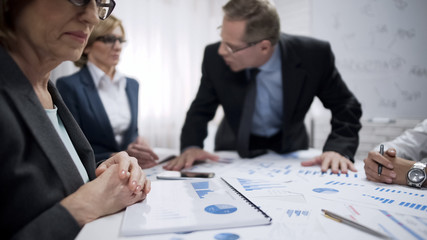 Angry male boss screaming at his subordinates, dissatisfied with work, stress