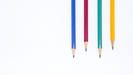 yellow, green, red and blue pencil isolated on white background