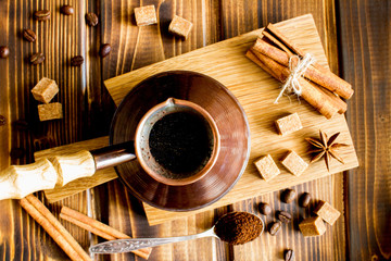 Turkish  coffee on the cutting board on the  brown  wooden background.Top view.