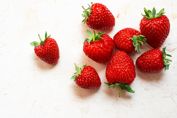 Messy arrangment of red delicious strawberries