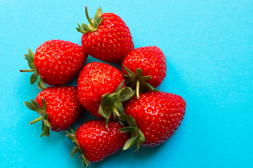 Red strawberries on blue background