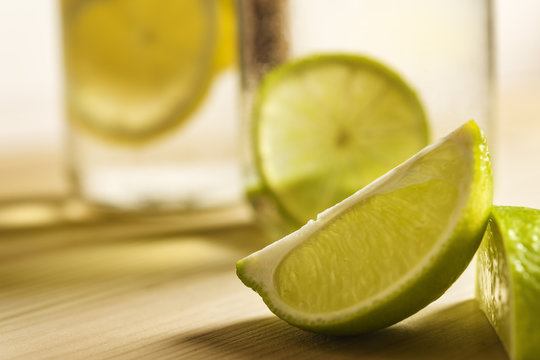 lemon slice with citrus soda in the background