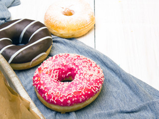Colorful donuts with chocolate and icing, selective focus