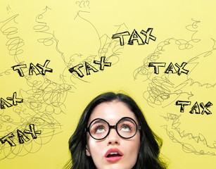 Tax with young woman on a yellow background