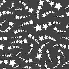 Seamless pattern. White stars on a black background. Vector illustration.