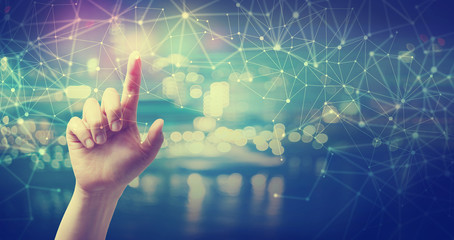 Network and connection technology concept with hand pressing a button at night