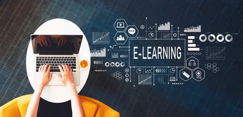 E-Learning with person using a laptop on a white table