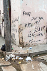 Garbage on a street in Matanzas, Cuba. The text says: Do not throw garbage.