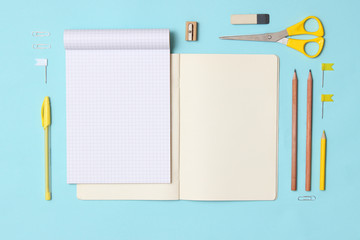 set of stationery on a colored background with space for text. back to school. office tools. flat lay, top view