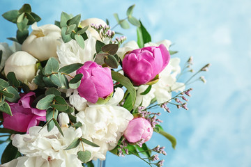 Bouquet of beautiful flowers on color background