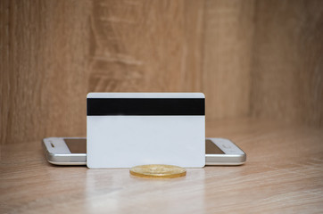 Bitcoin on plastic credit card. Bitcoin cash trading. 2018 bitcoin golden model. Copy space. Buy or sell bitcoins