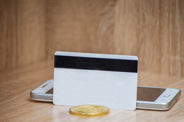 Bitcoin on plastic credit card. Bitcoin cash trading. 2018 bitcoin golden model. Copy space. Buy or sell bitcoins