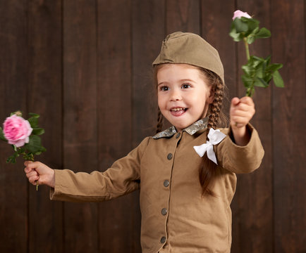 child girl are dressed as soldier in retro military uniforms