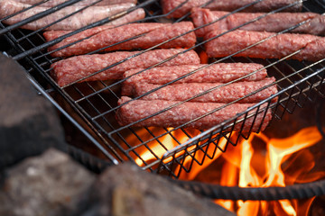 Sausage fire-roasted on the grill