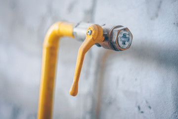 Yellow gas pipe in the house, putting the gas main into the house