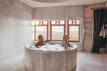 Romantic couple taking a bath with a view