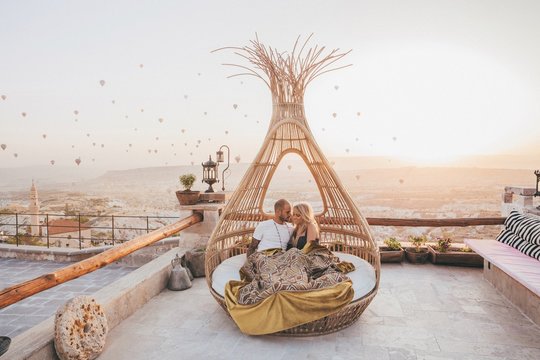 Romantic Couple watching a sunrise in a basquet in Cappadocia