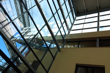 Modern architectural elements with reflections and blue sky