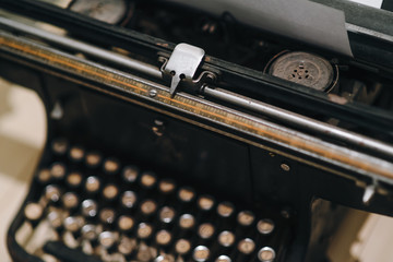 Details of an old retro typewriter, vintage style, dusty surfaces.