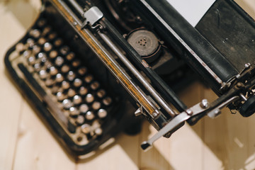 Fototapeta na wymiar Details of an old retro typewriter, vintage style, dusty surfaces.