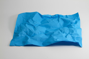 crumpled light blue paper