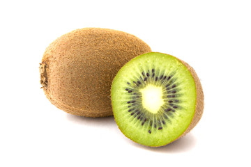 Kiwi on white background. Whole kiwi close-up on white background. Next, a fruit cut in half.