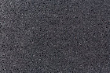 Black asphalt road, background texture close-up