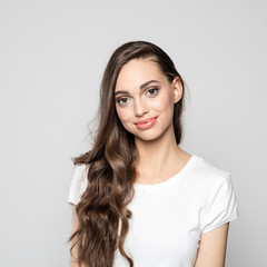 Portrait of cute young woman with long hair