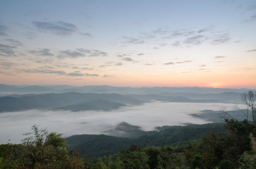 Fototapeta na wymiar Beautiful clouds and fog among mountain landscape.