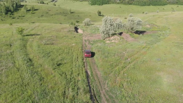 the car is moving over rough terrain. Subaru car forester.	