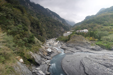 River flows through the mountains.