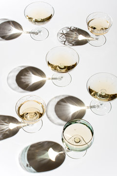 Champagne glasses with strong shadows