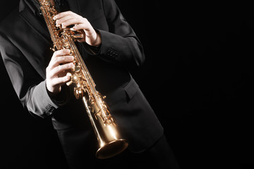 Saxophone player. Saxophonist playing soprano sax jazz music instrument. - obrazy, fototapety, plakaty