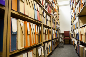 Technical archive room with a lot of cardboard boxes full of detailed drawings