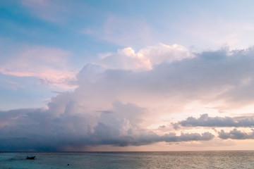 Obraz premium Amazing tropical landscape view. Colorful sky and clouds view with calm sea and relaxing tropical mood. Gorgeous nature background. Maldives, Indian Ocean.
