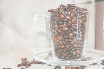 a cup of coffee on a light background, coffee beans, a cheerful morning