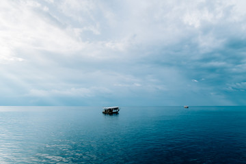 Rasdhoo Atoll, Green blue sea in Maldives with boat